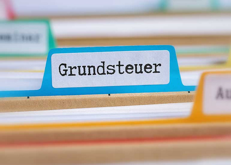 Ausschnitt auf Aktenregister. Auf einem Reiter ist „Grundsteuer“ zu lesen.