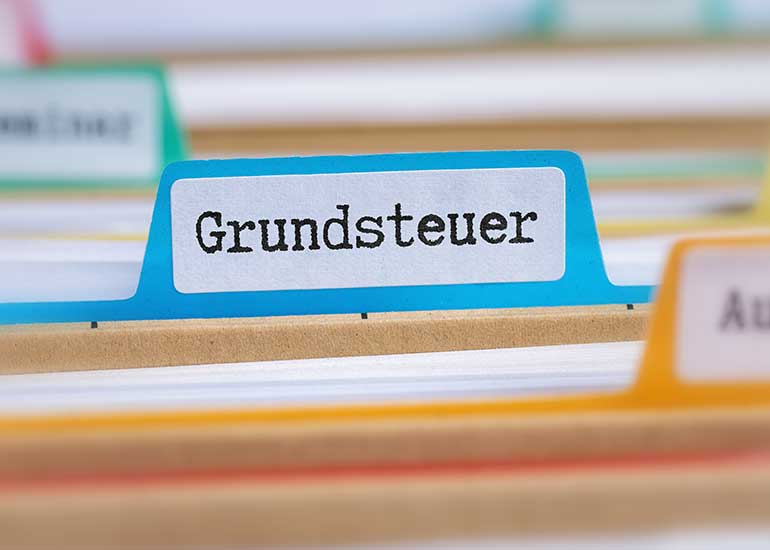 Ausschnitt auf Aktenregister. Auf einem Reiter ist „Grundsteuer“ zu lesen.